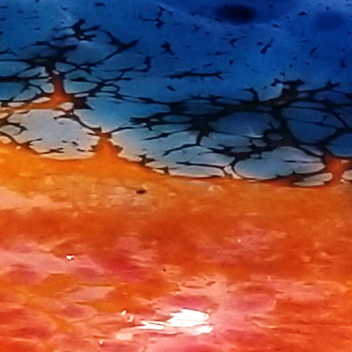 detail image of blown blue and orange/red glass fused together