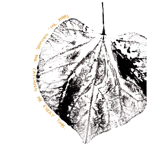 A leaf pressed into black ink on paper